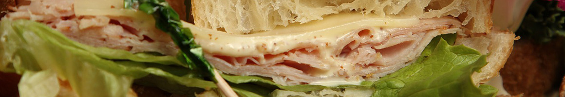 Eating Deli Sandwich at Tropical Smoothie Cafe restaurant in Fredericksburg, VA.